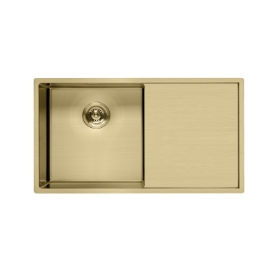Light gold kitchen sink with drainboard